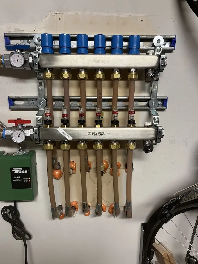 Plumber performing Water Heater Repair at a residential property in Deerfield